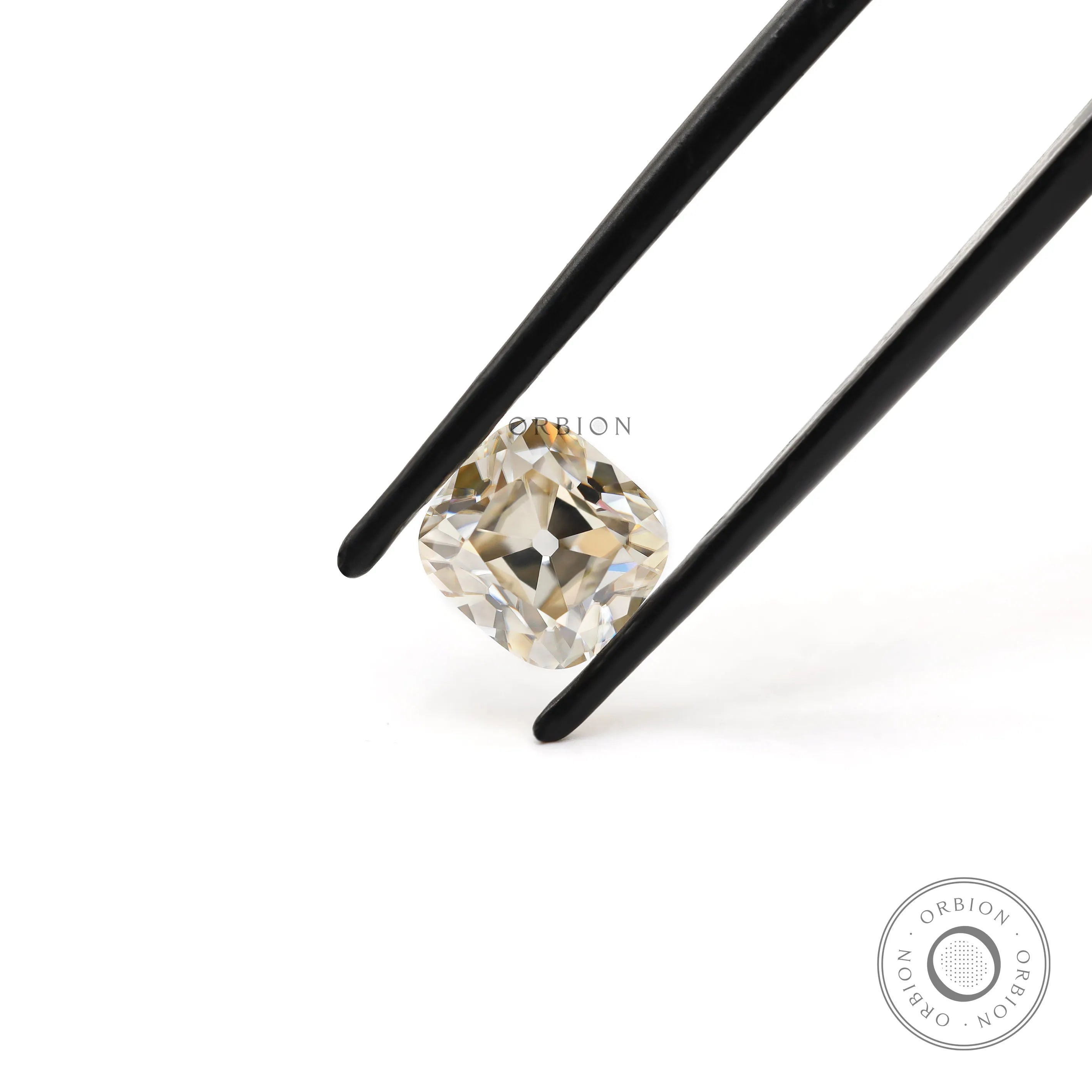 1.70 ct Elongated cushion moissanite with warm off white hue old mine cut