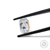 elongated cushion old mine cut moissanite held in tweezer showing side profile