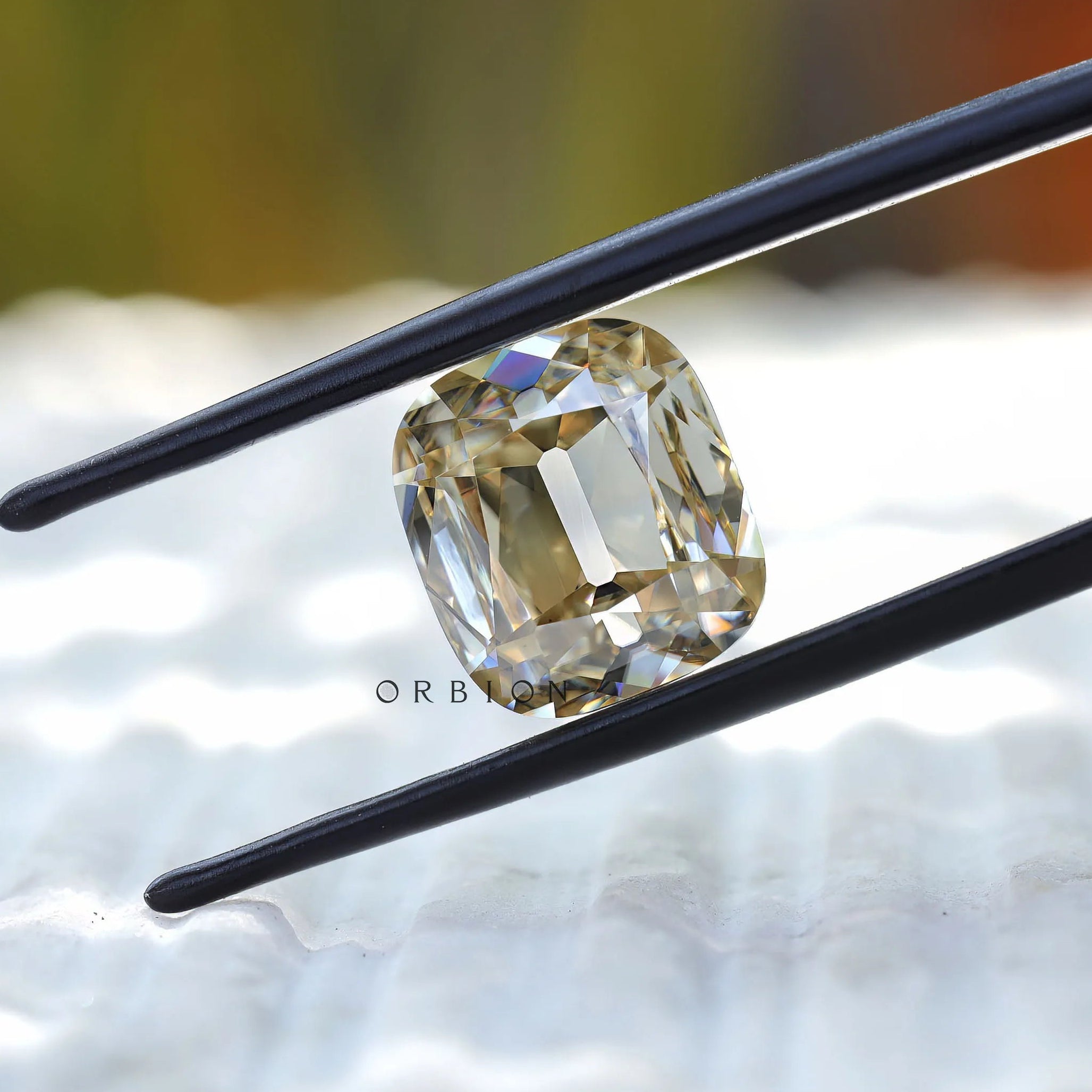 Close view of antique style faceting in elongated cushion moissanite