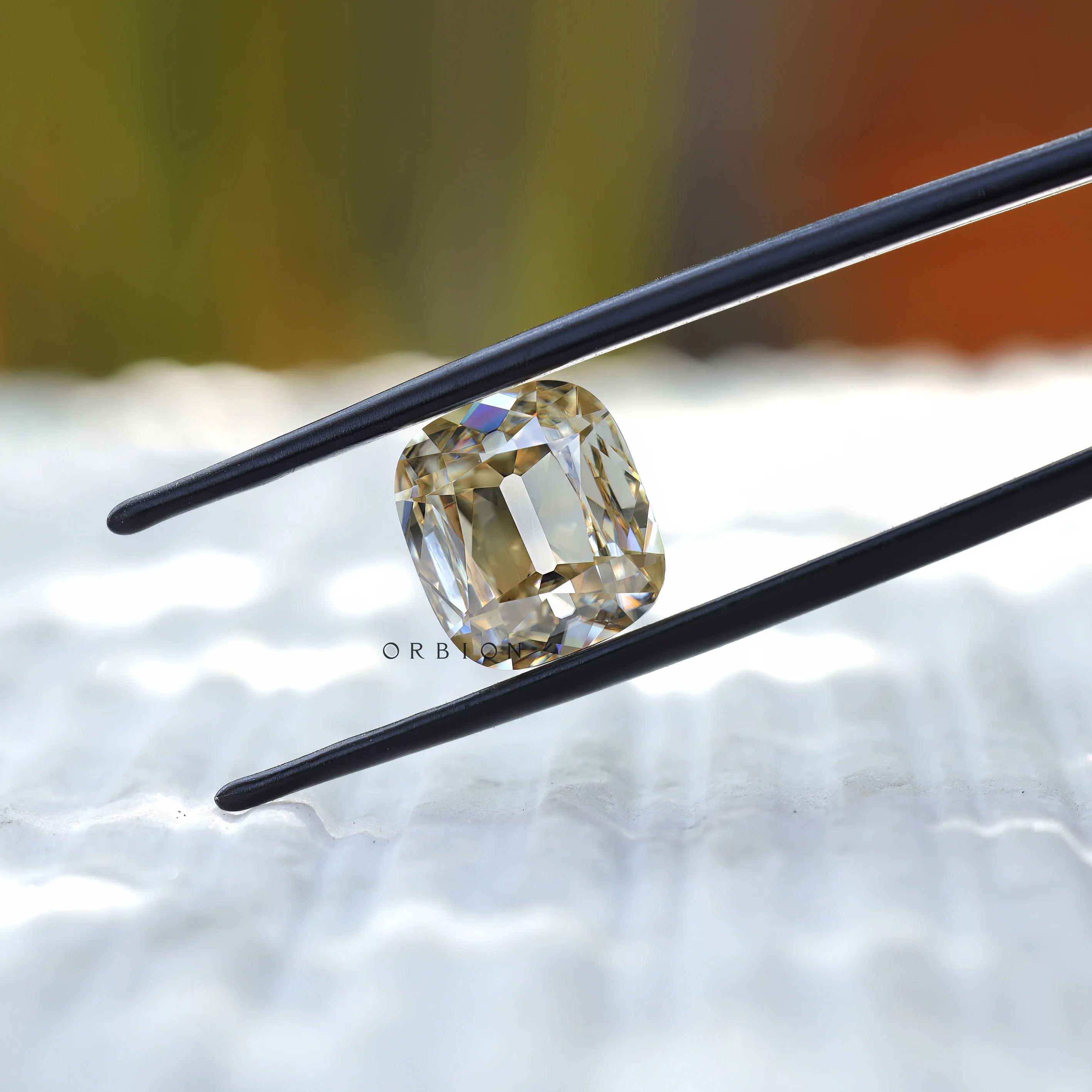 Close view of antique style faceting in elongated cushion moissanite