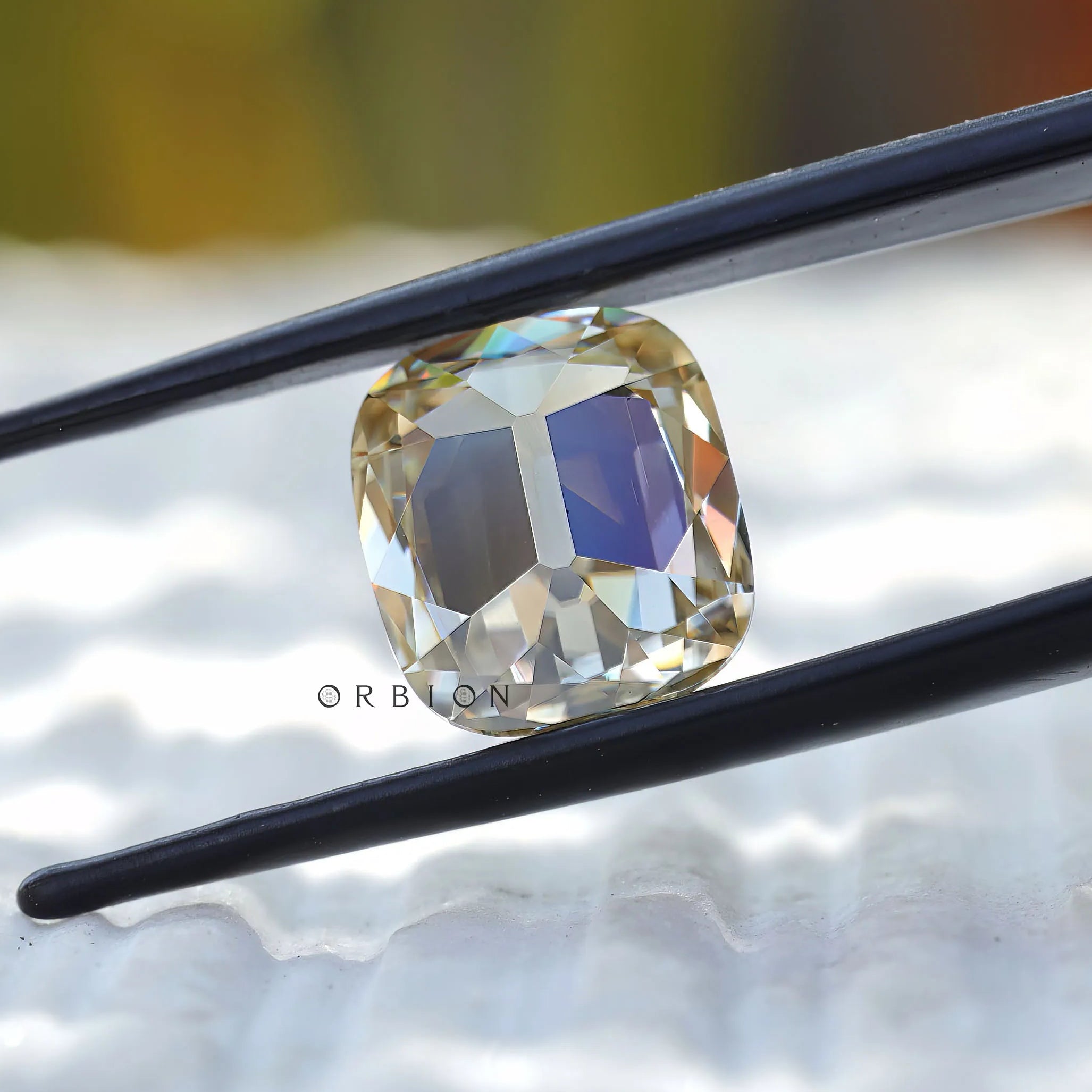 Cushion cut moissanite displaying vintage facet reflections