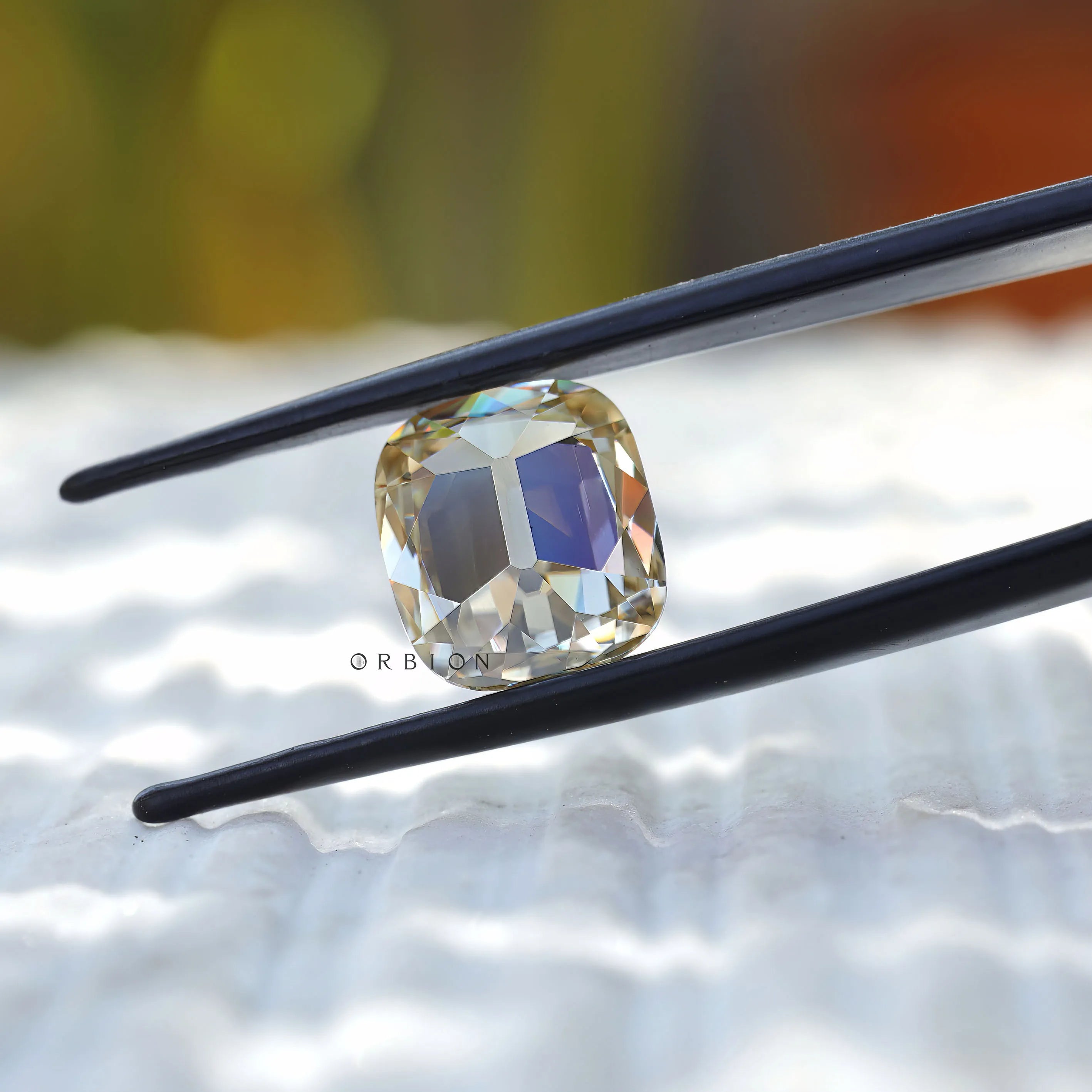 Cushion cut moissanite displaying vintage facet reflections