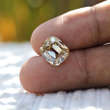 Top view of elongated cushion moissanite with soft yellow tone