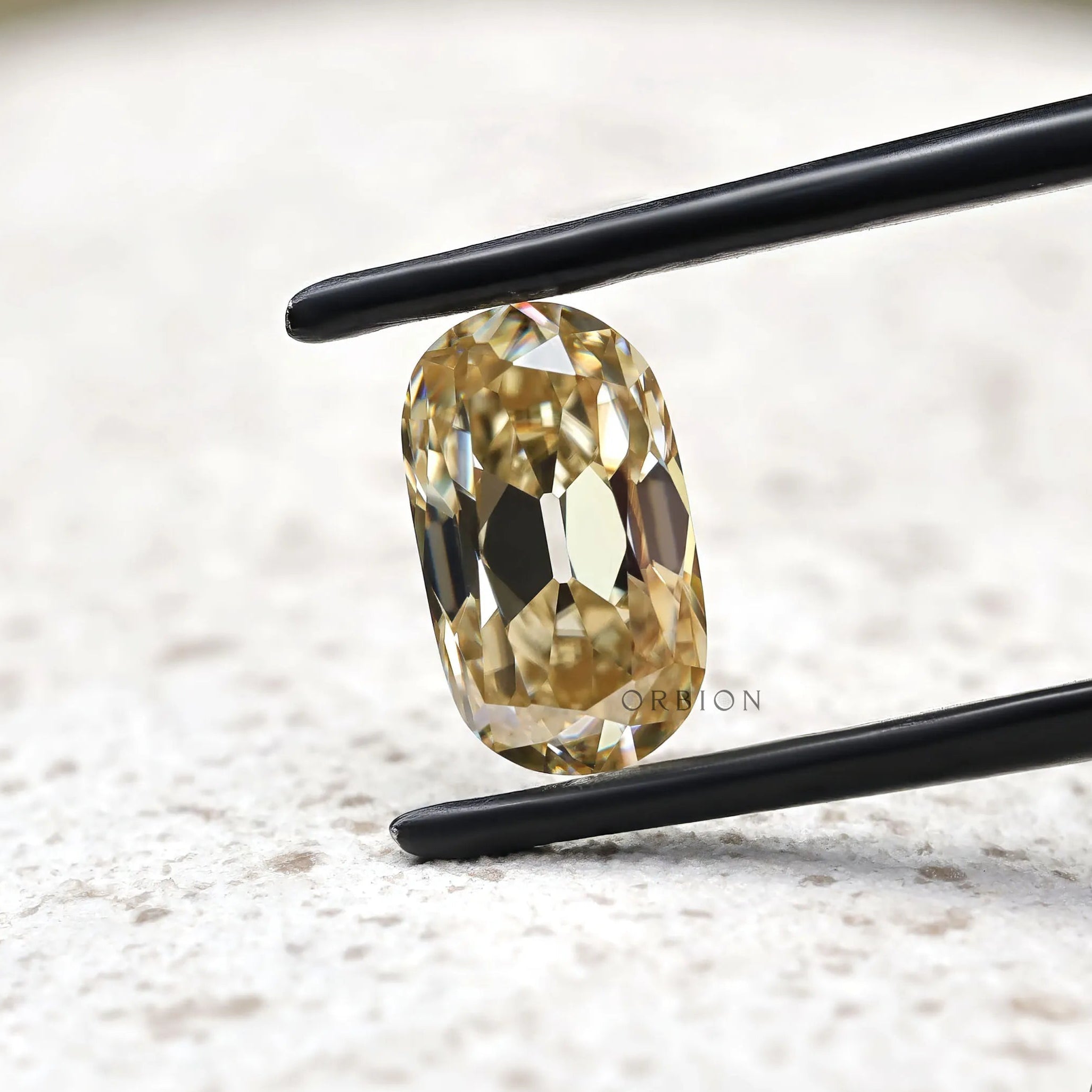 Antique cut elongated cushion champagne moissanite loose stone detail