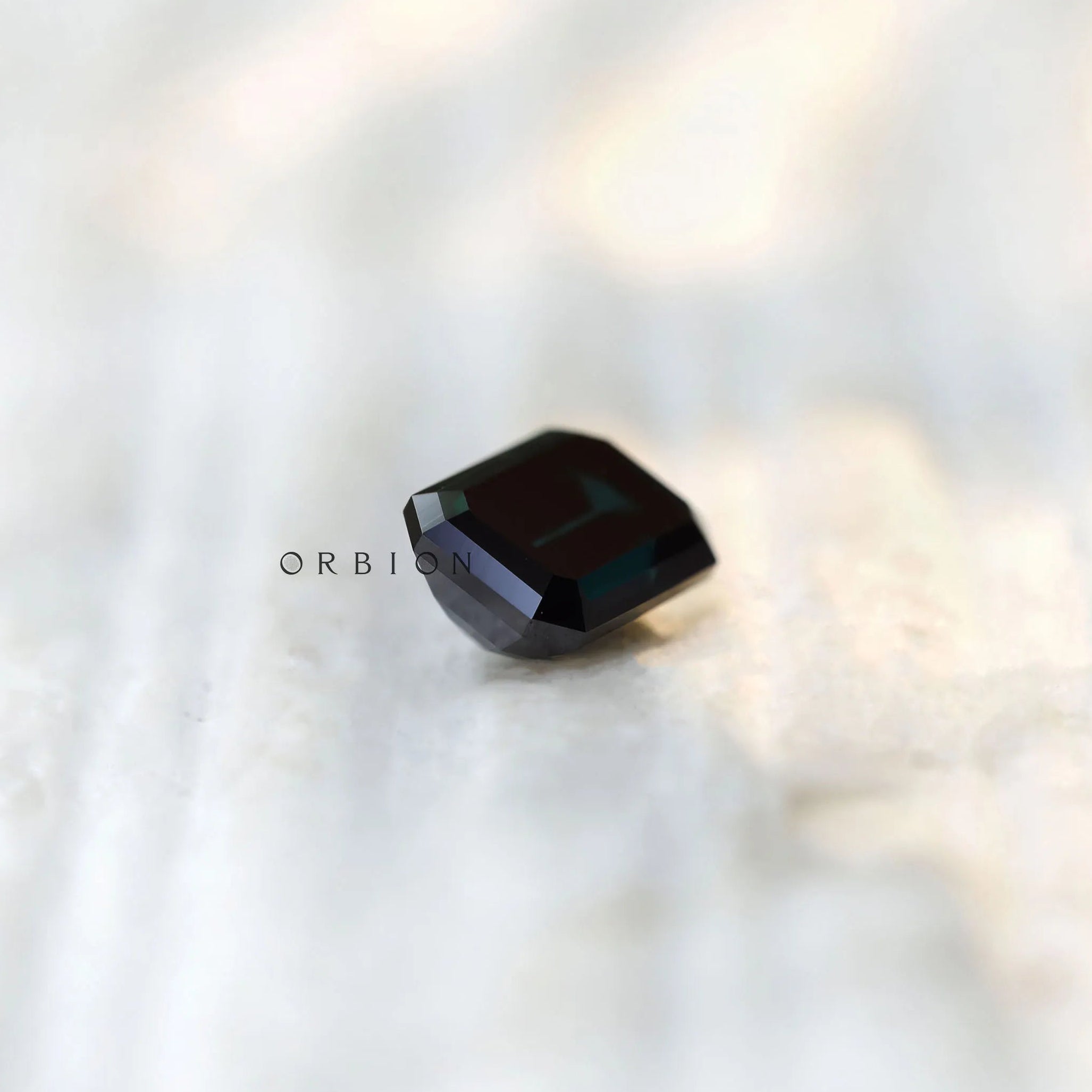 Loose emerald shape moissanite black green shade top view