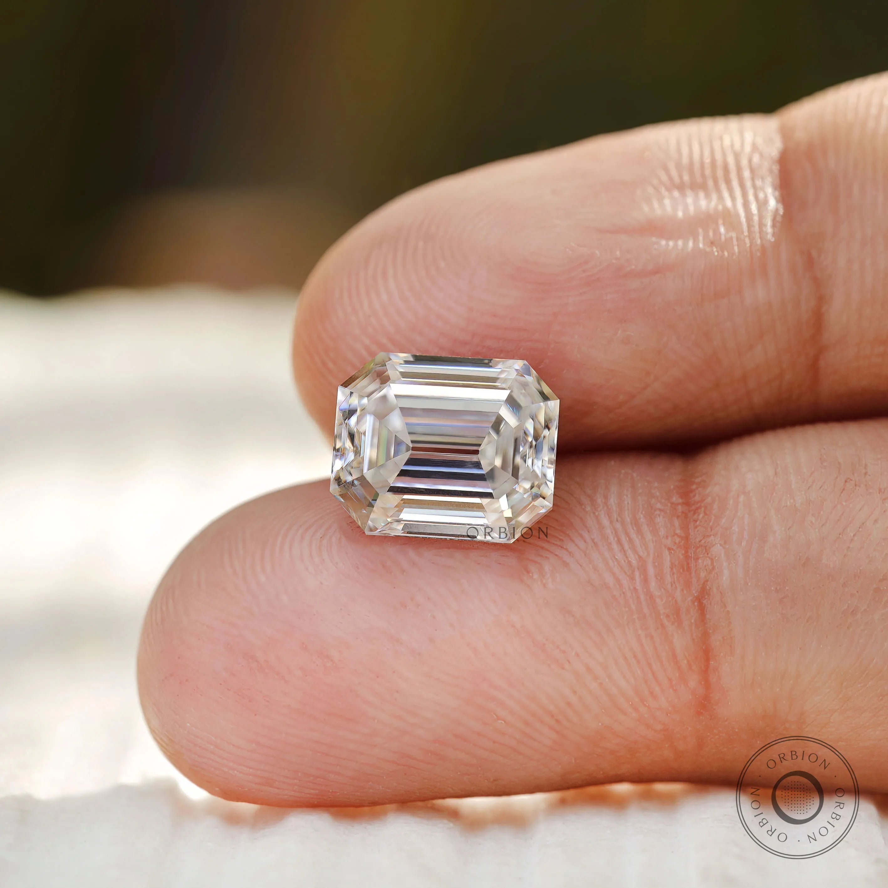 2.50 ct Emerald style moissanite with vintage faceting colorless tone