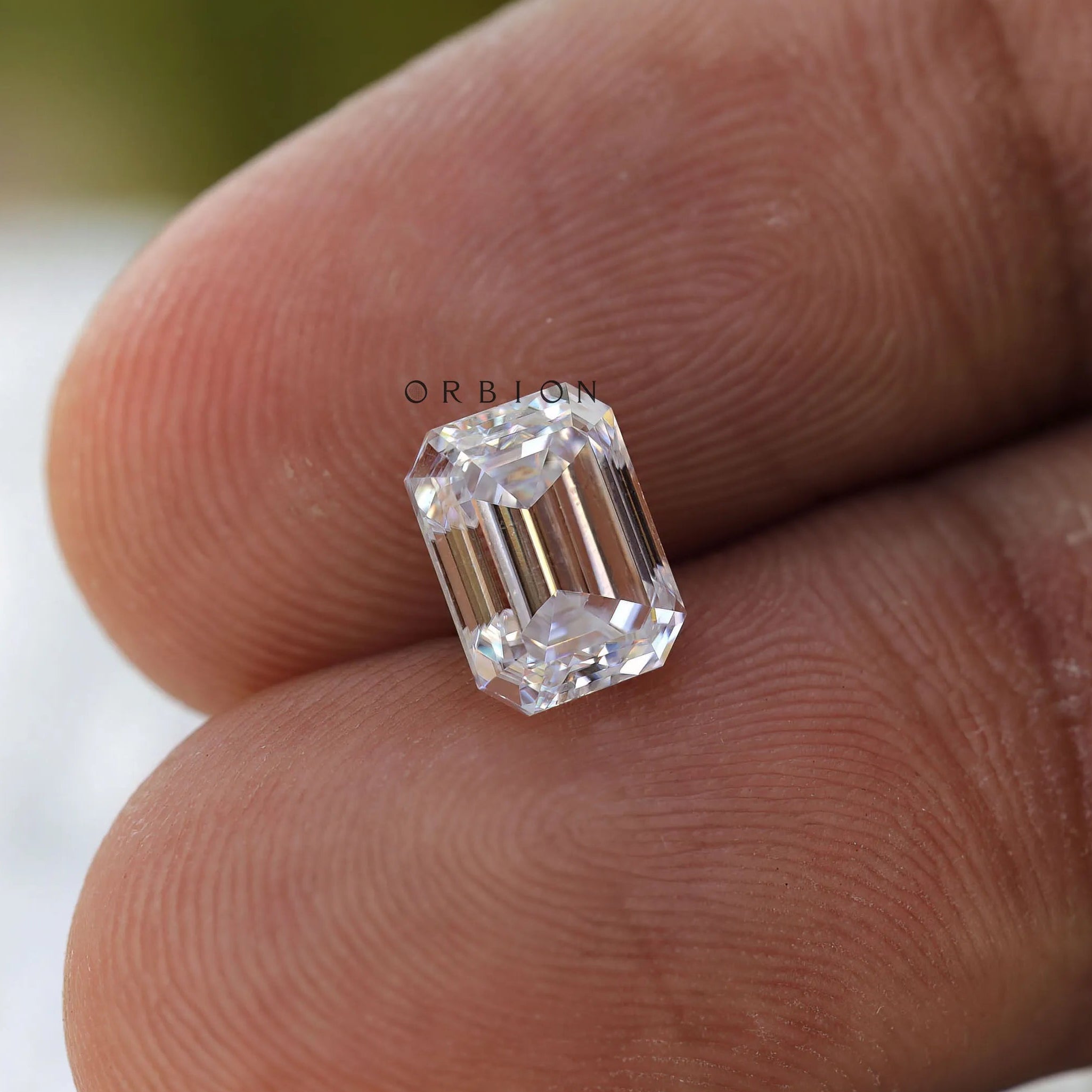 Loose colorless emerald cut moissanite for bespoke ring designs
