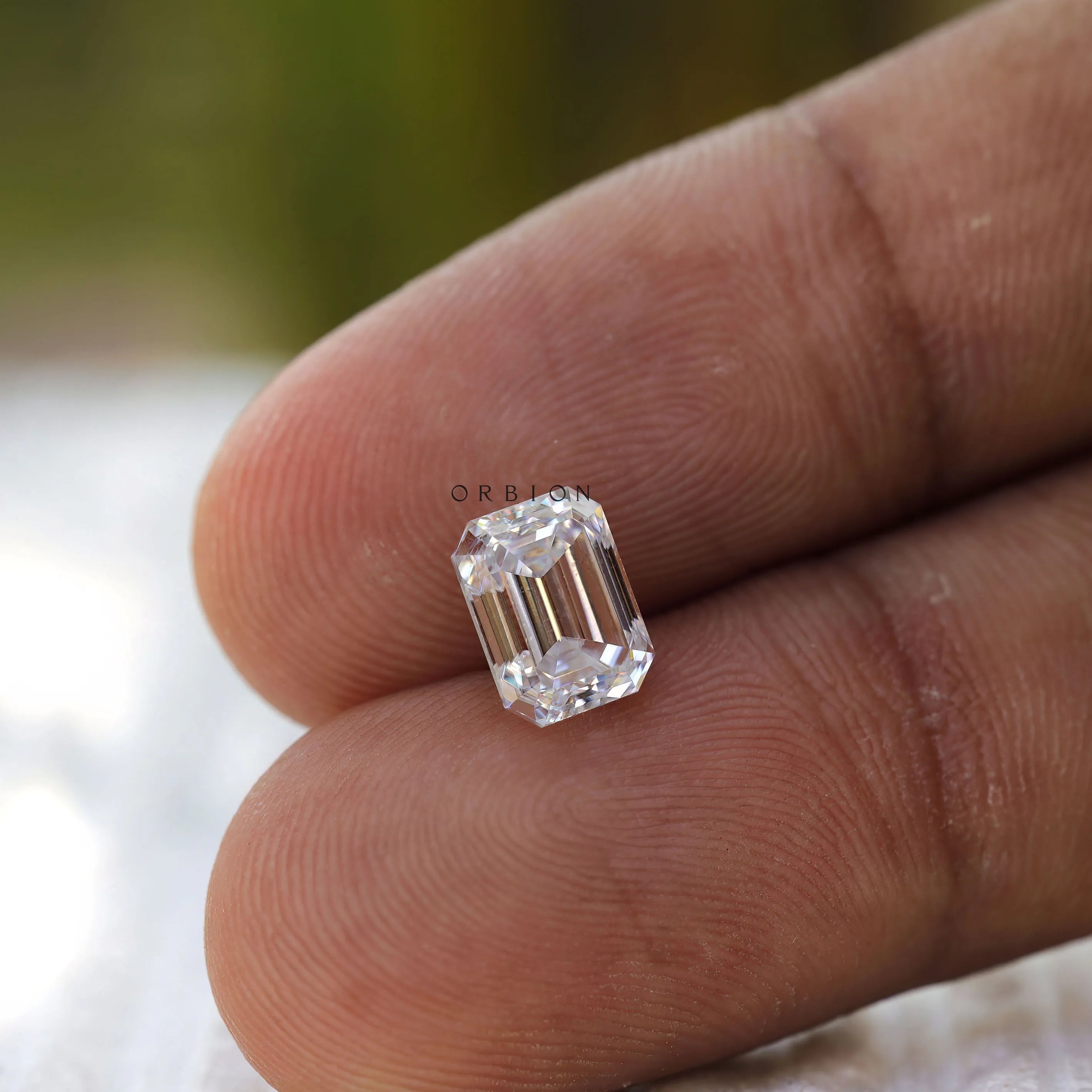 Loose colorless emerald cut moissanite for bespoke ring designs