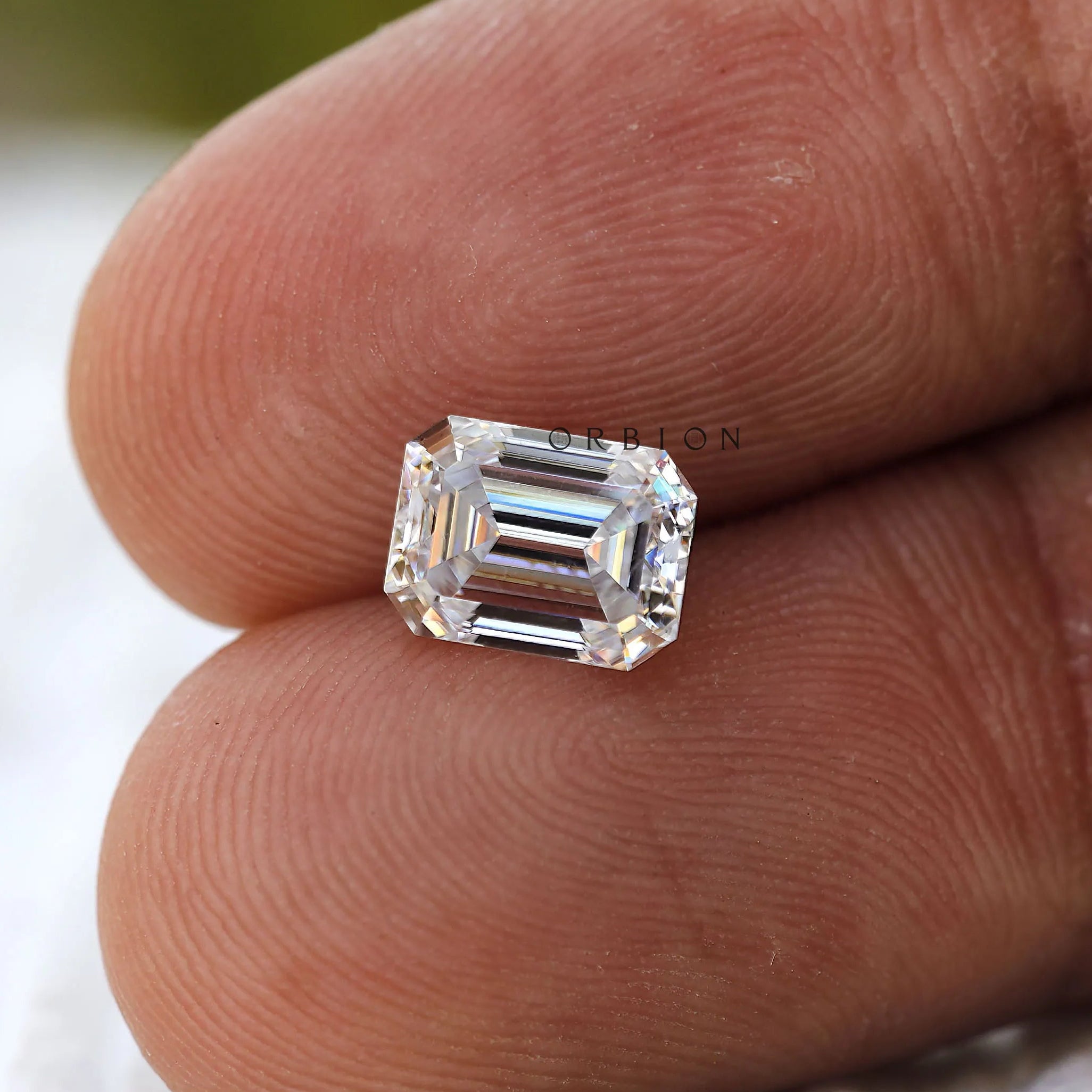 Emerald cut colorless moissanite stone