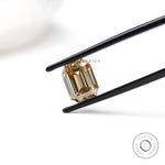Elongated emerald style moissanite in dark champagne tone 
