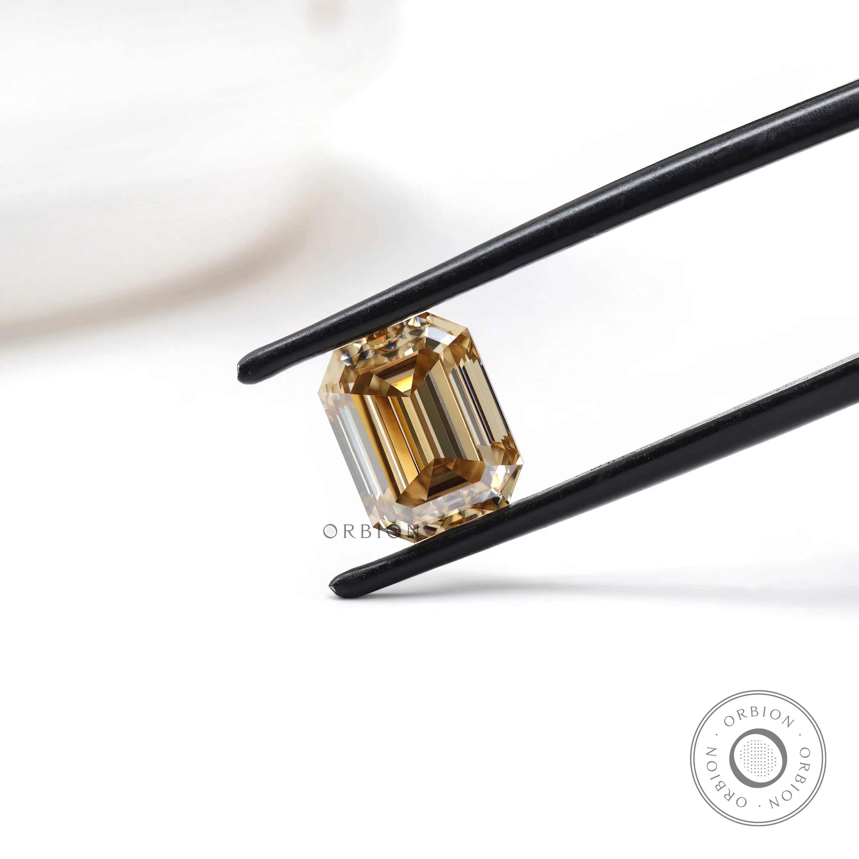 Step cut moissanite gemstone with deep champagne color and clean lines