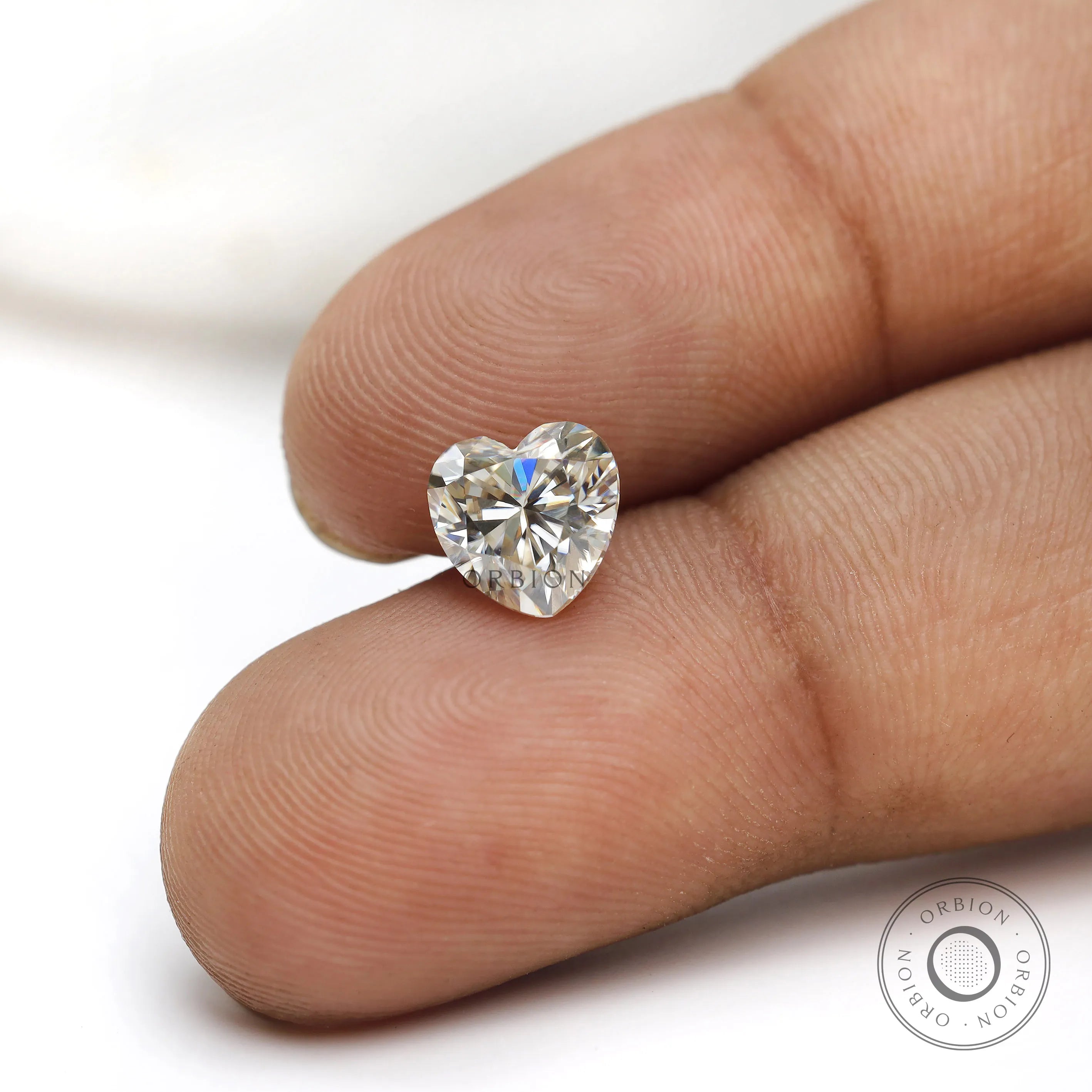 Close view of heart moissanite brilliance on skin tone