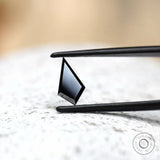 Geometric black moissanite stone step cut profile view