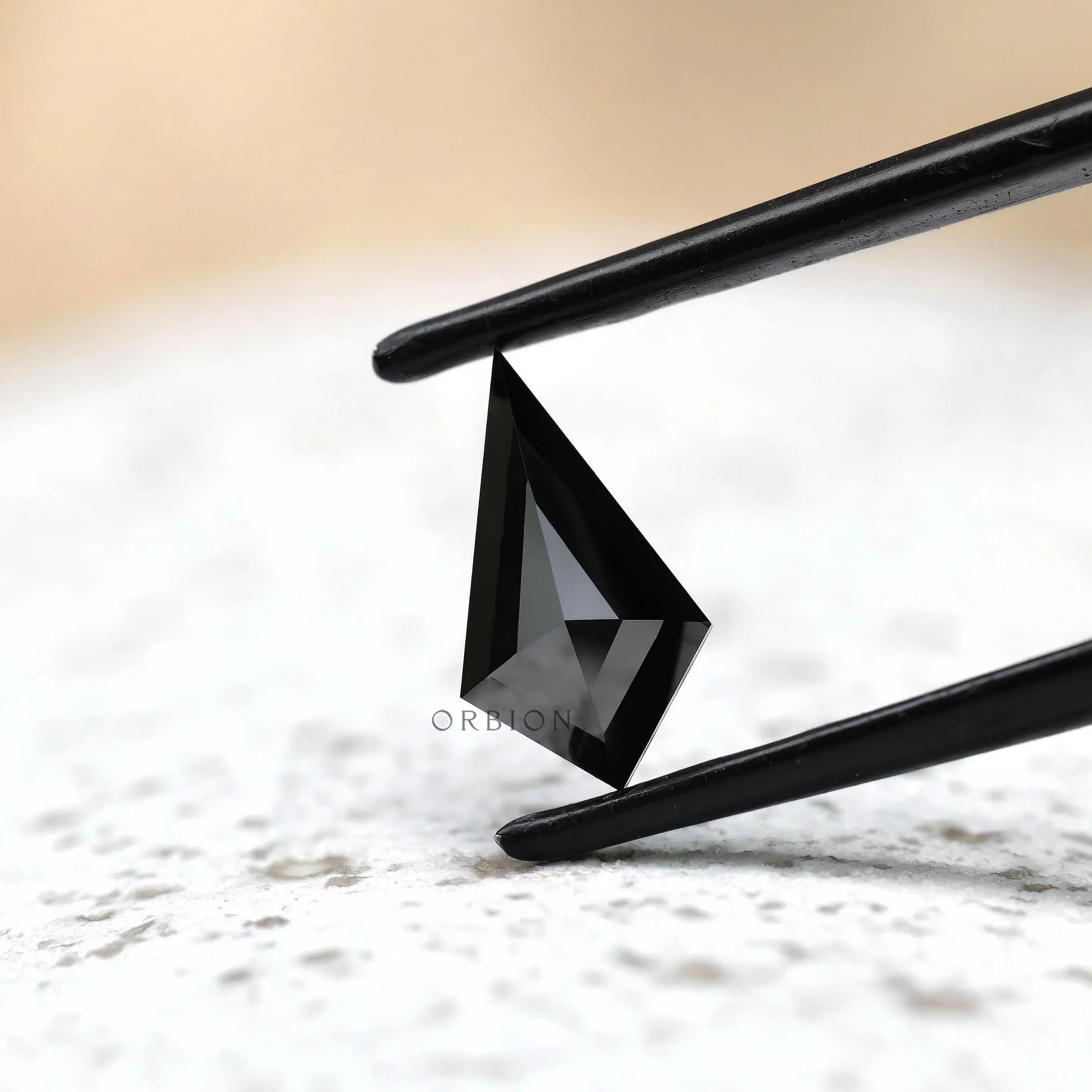 Modern black kite cut moissanite minimal background