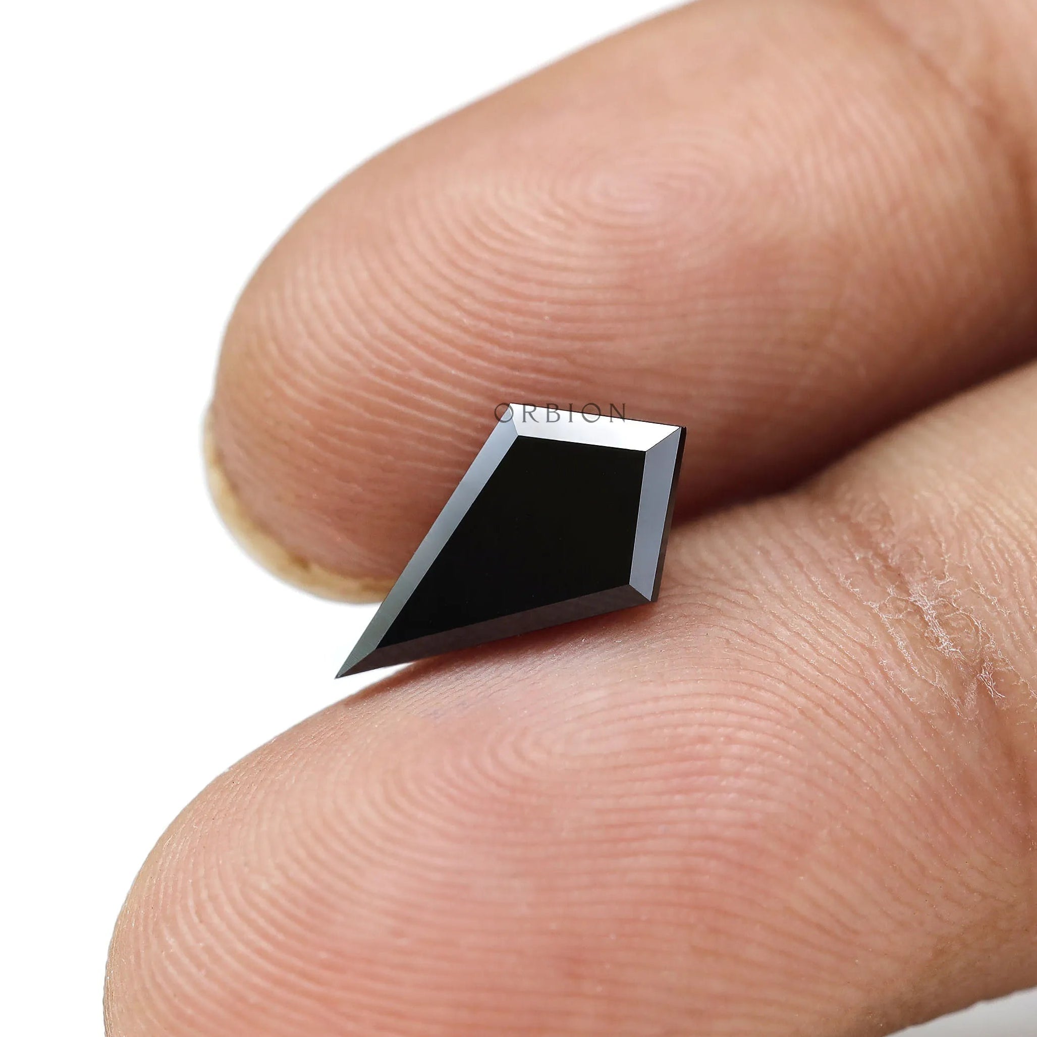 Black moissanite step cut showing sharp facet edges
