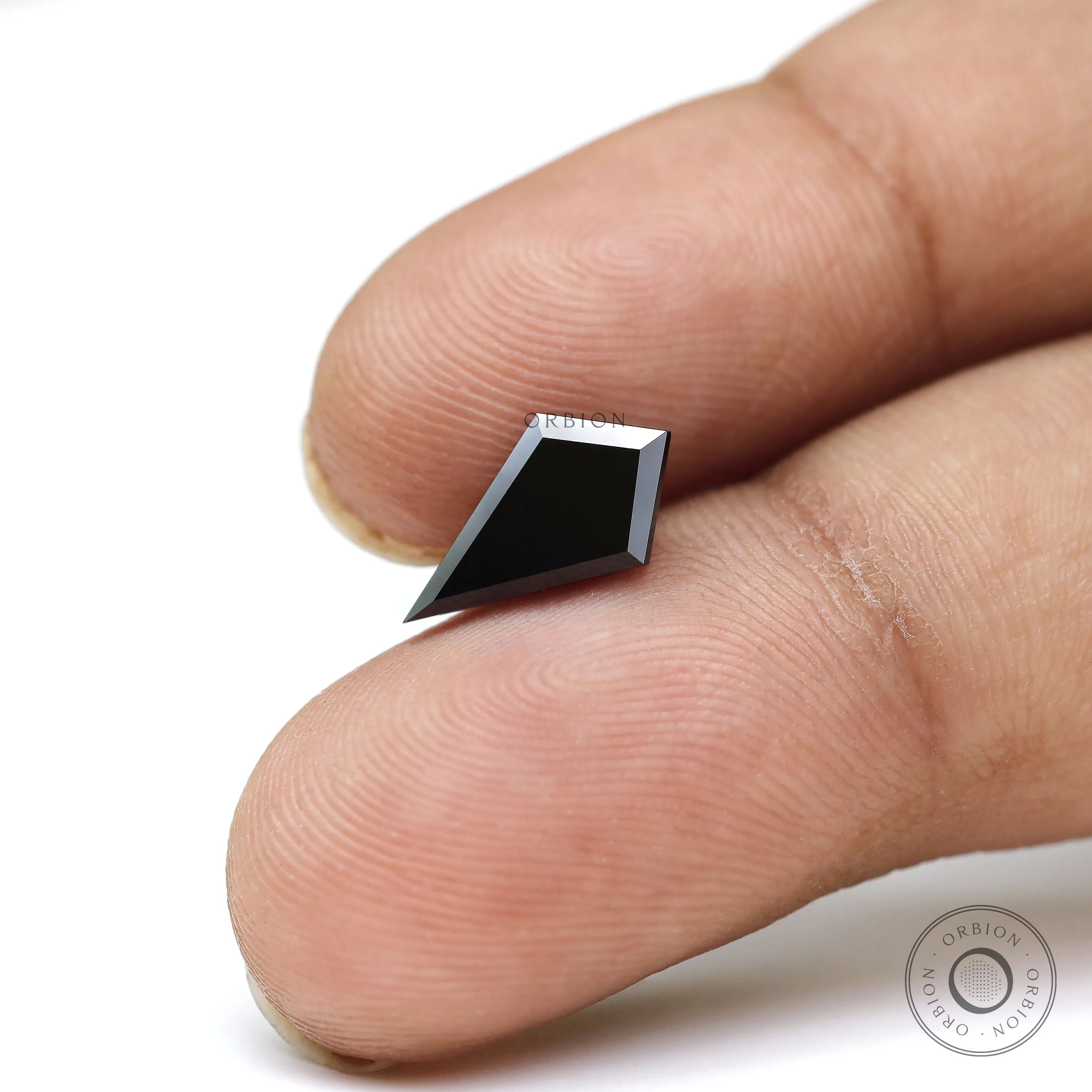 Black moissanite step cut showing sharp facet edges