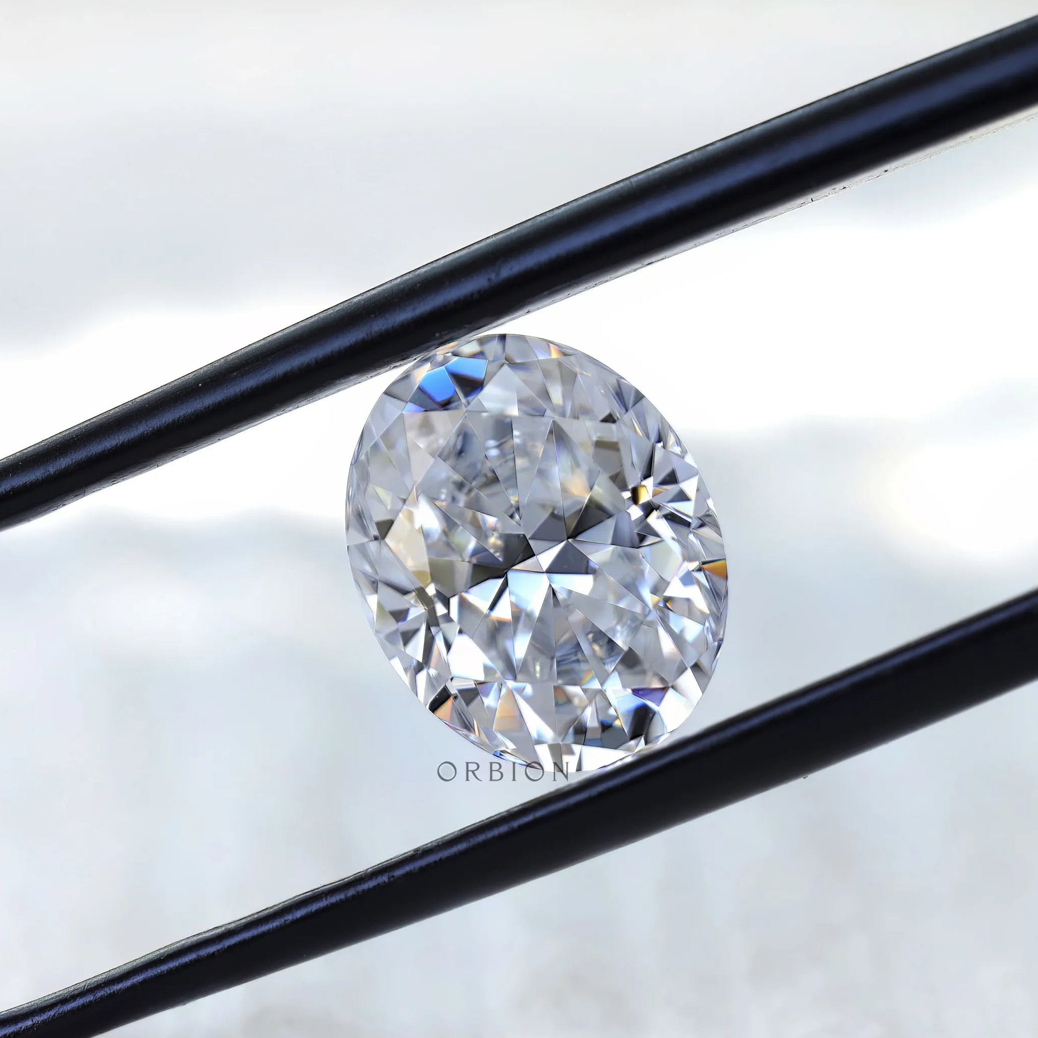 Crushed ice oval moissanite reflecting natural light