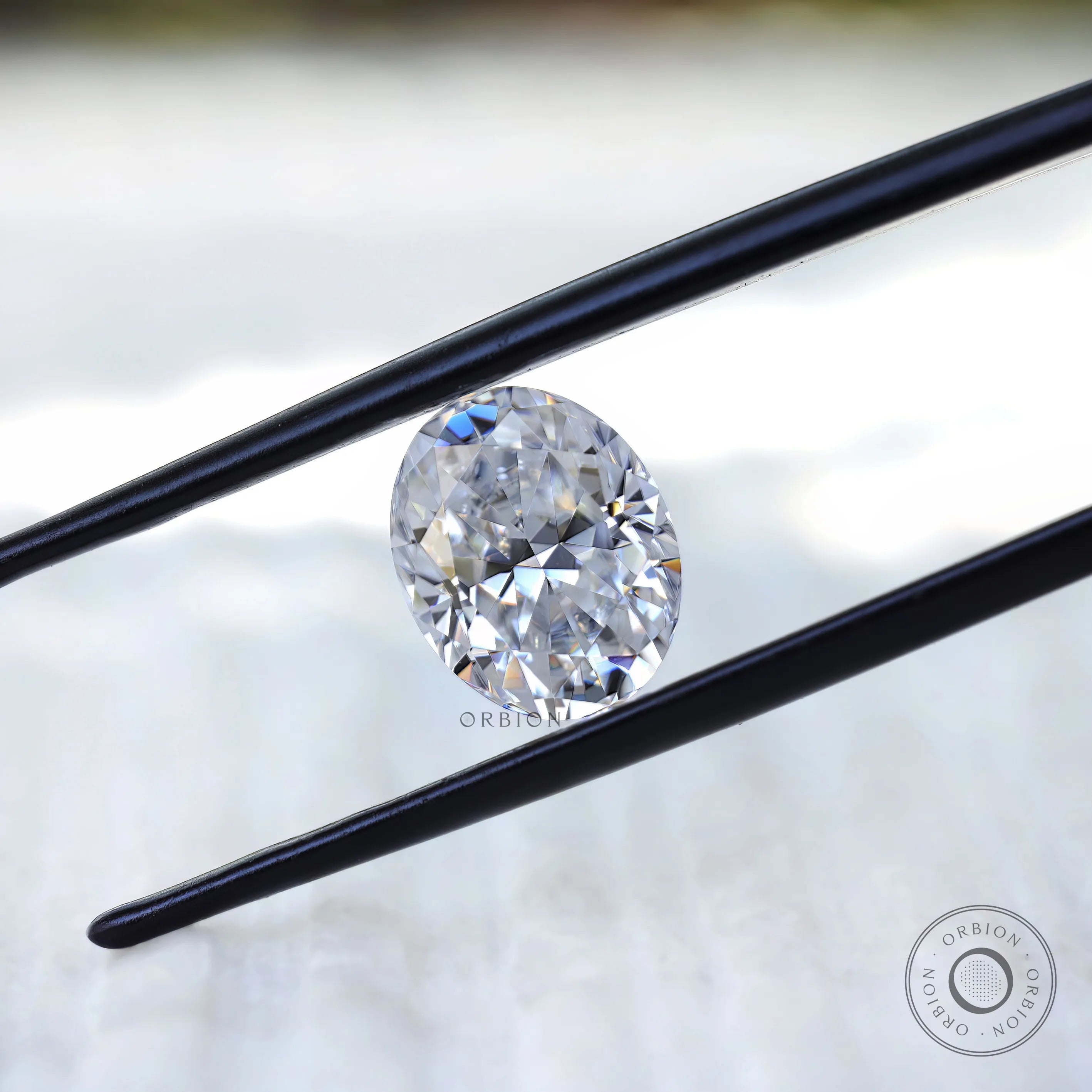 Crushed ice oval moissanite reflecting natural light