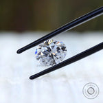 Loose oval moissanite showing hybrid cut facet pattern