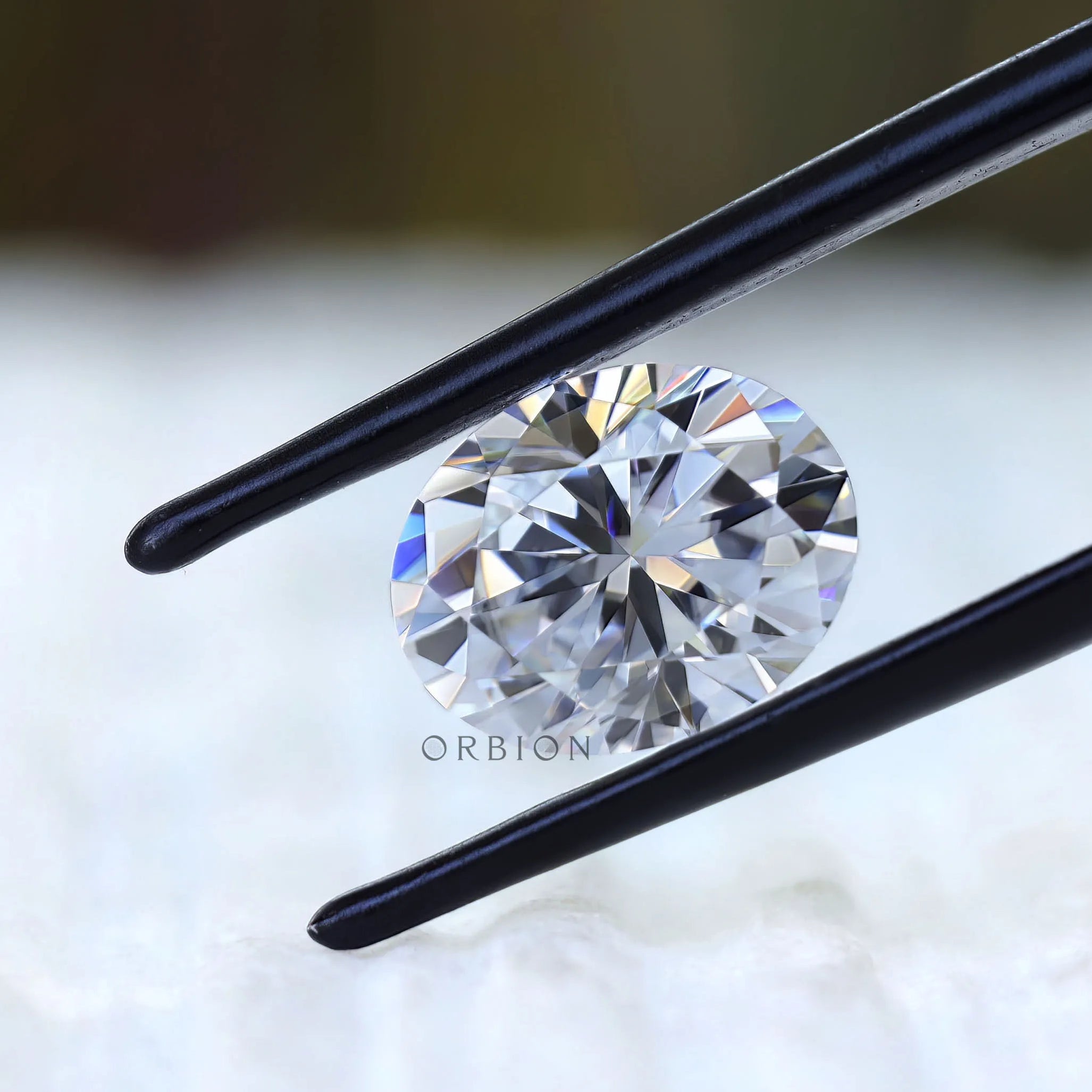 Loose oval moissanite showing hybrid cut facet pattern
