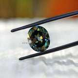 Deep green oval moissanite with vintage faceting