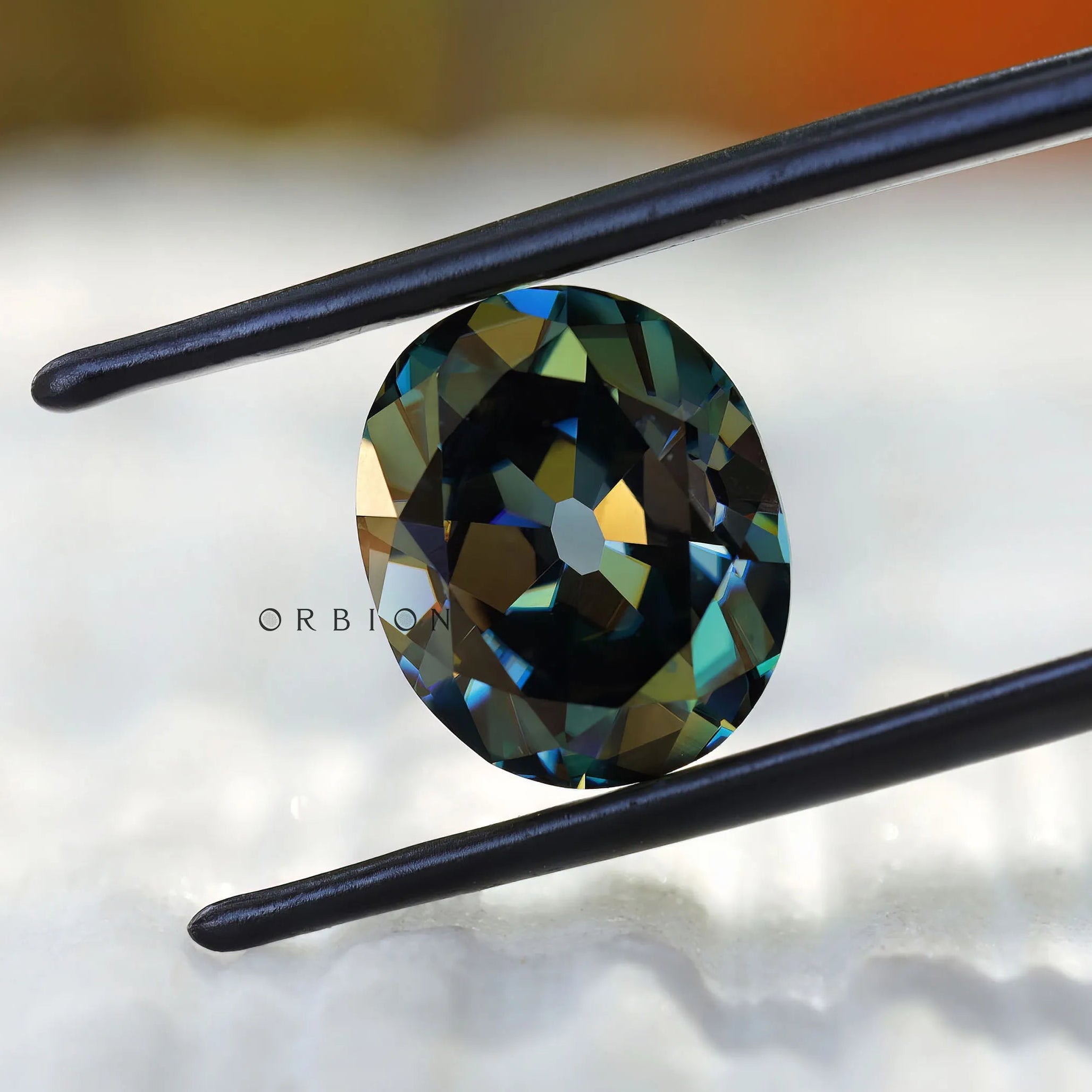 Deep green oval moissanite with vintage faceting