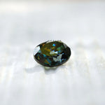 Oval Old Mine Cut moissanite rich green tone reflection