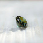 Dark green moissanite oval shape facet detail