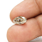 Elongated oval moissanite with warm champagne tone