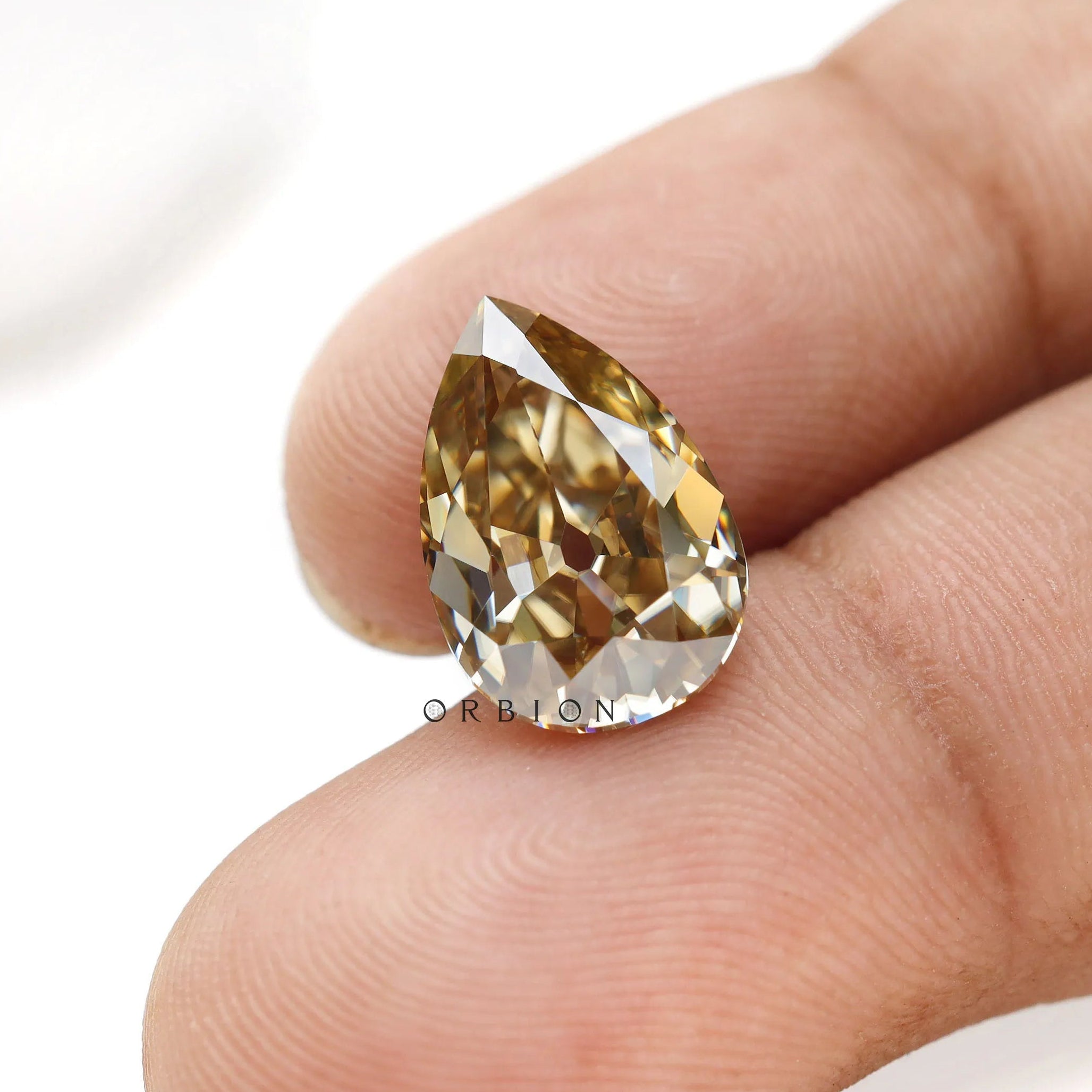 Custom jewelry pear moissanite in rich warm champagne shade