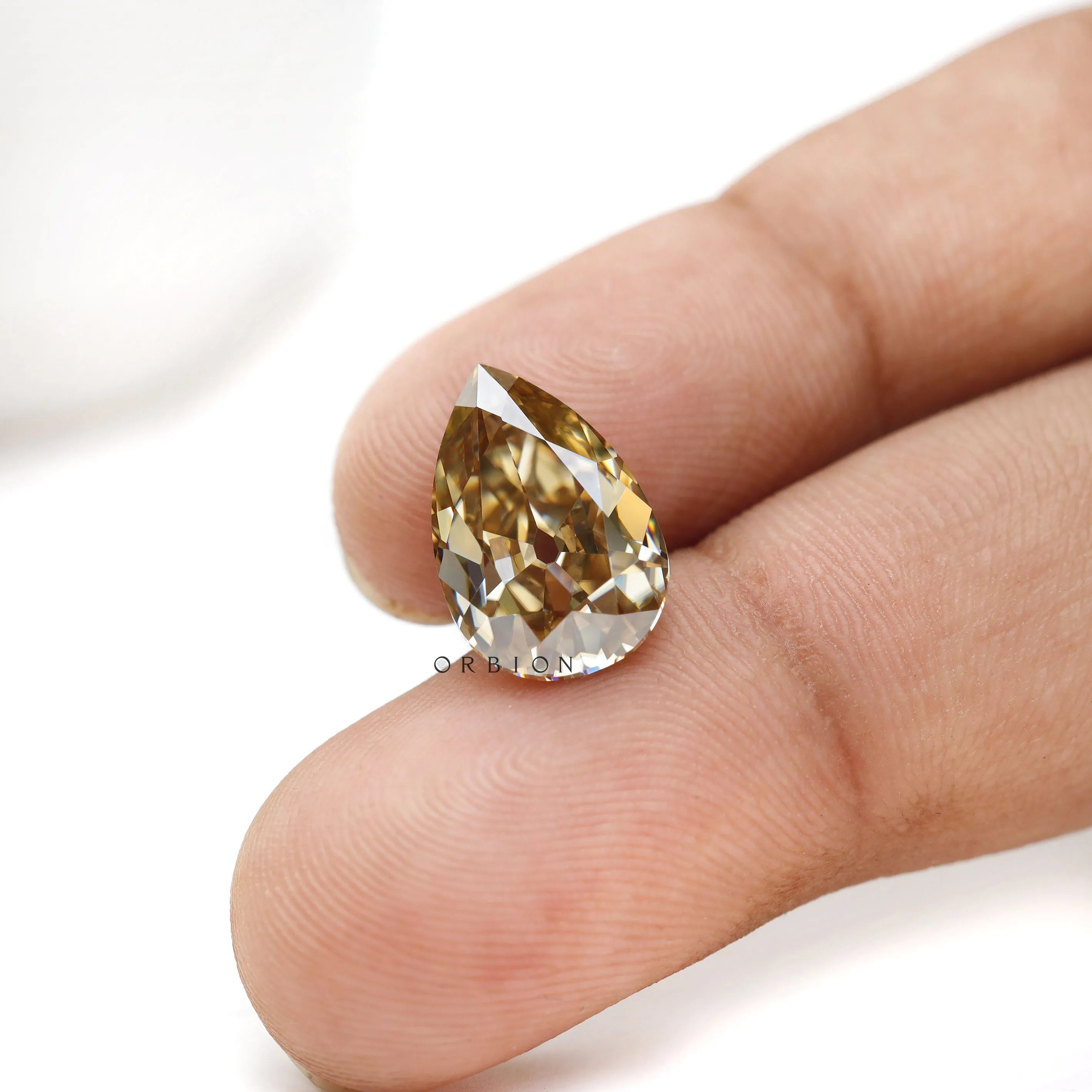 Custom jewelry pear moissanite in rich warm champagne shade