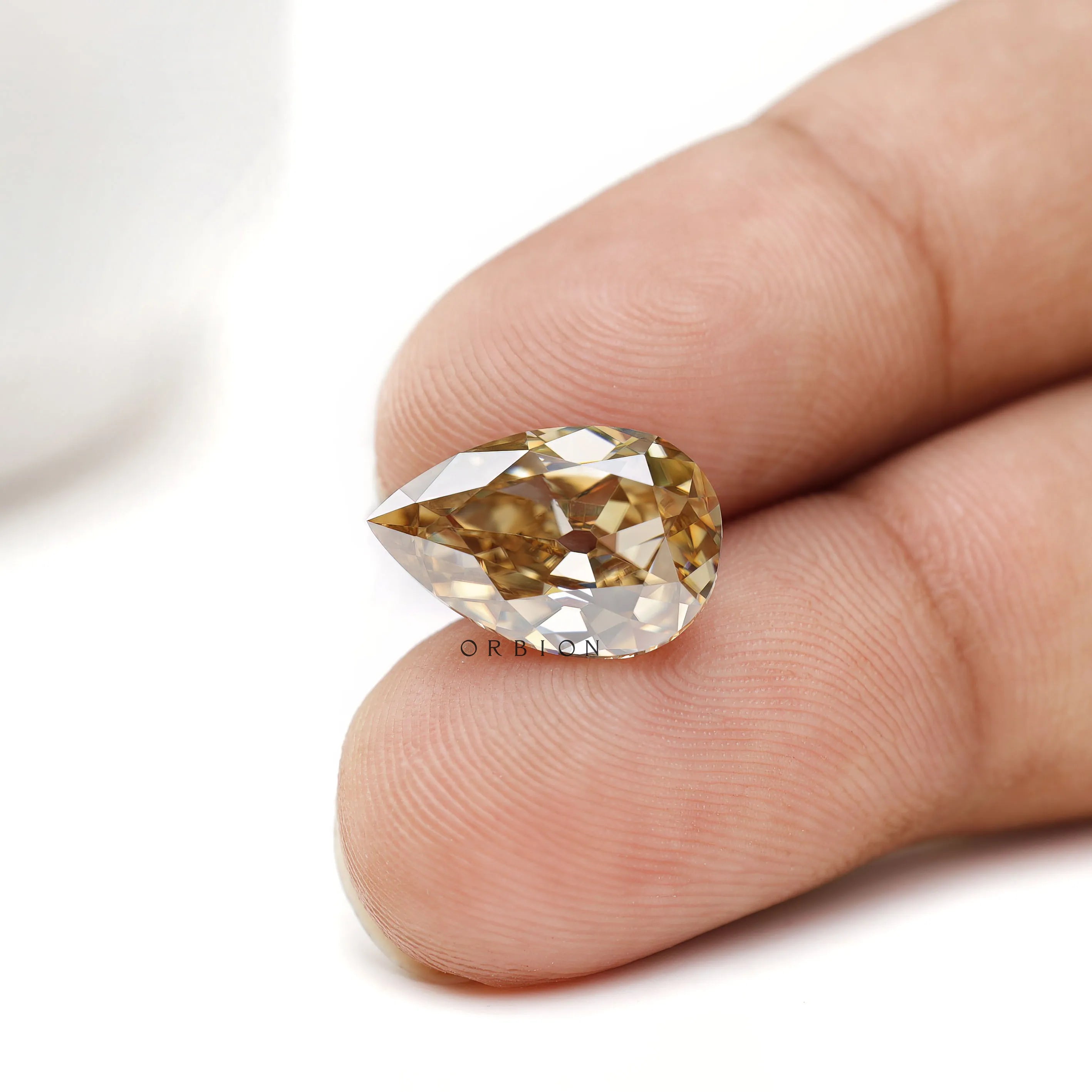 Unique pear shaped moissanite with old mine cut and deep tone