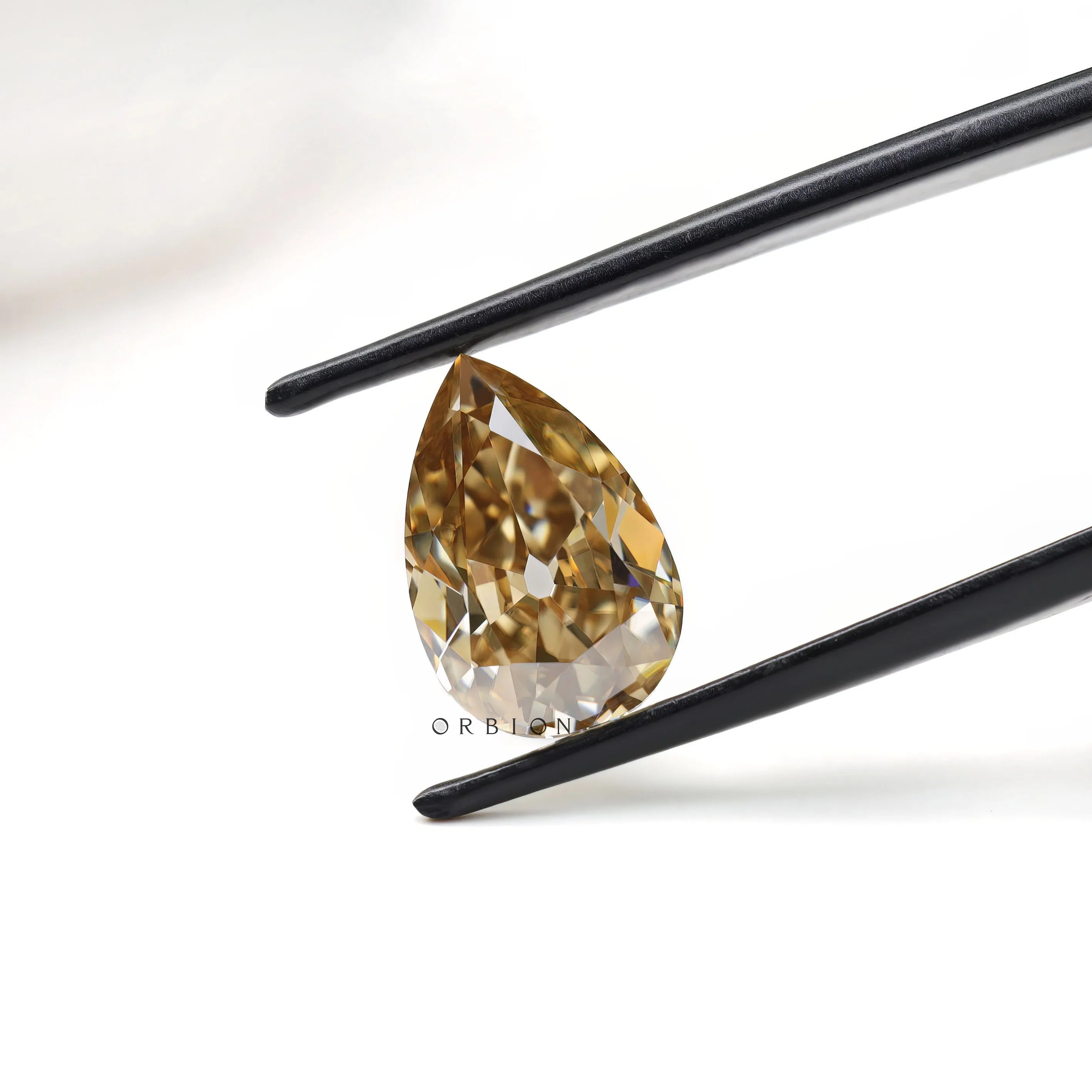 3.50 ct pear shaped moissanite in rich dark champagne tone