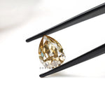 Vintage inspired pear moissanite gemstone with warm brown hue