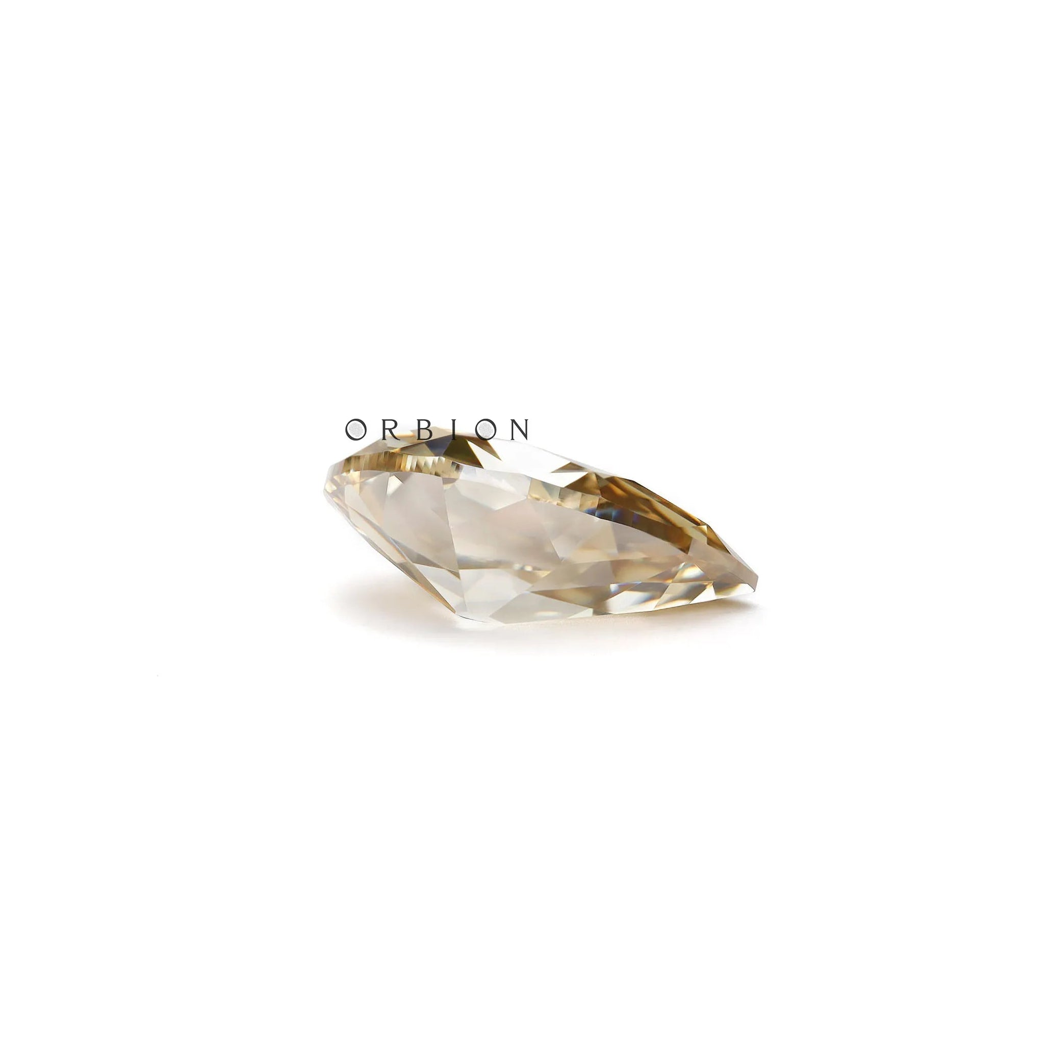 Antique cut pear moissanite stone with bold dark champagne color