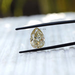 4.20 CT Pear cut moissanite in off white, old mine cut gemstone