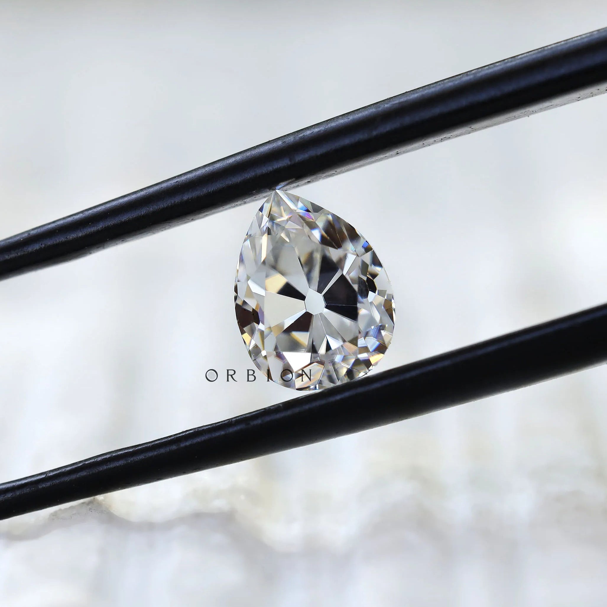 Close view of pear DEF moissanite sparkle