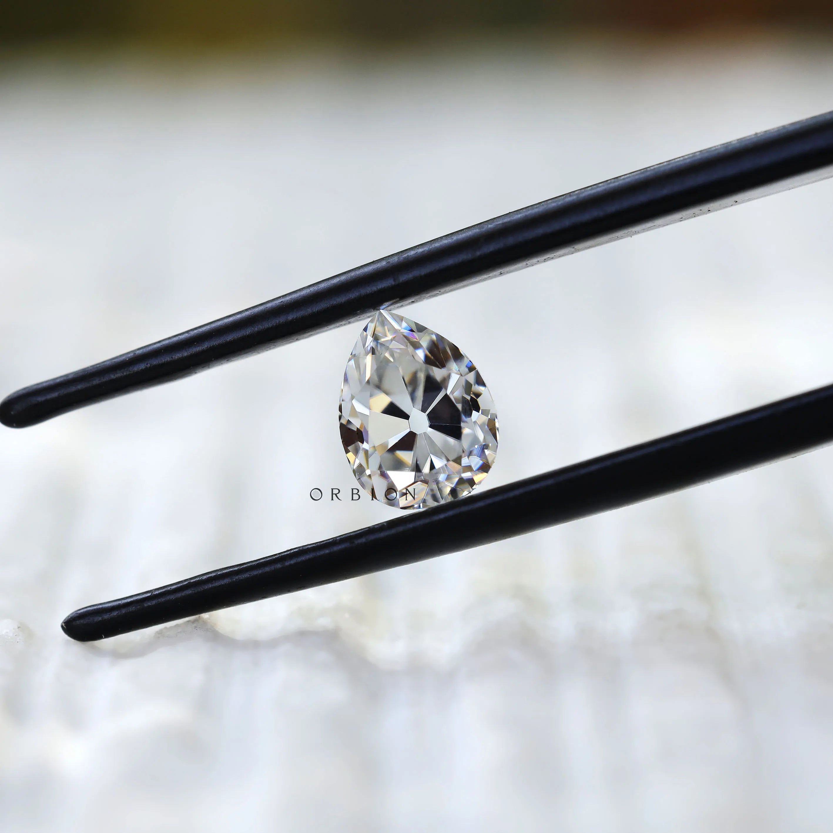 Close view of pear DEF moissanite sparkle