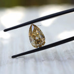 Pear shaped moissanite 2.80 ct in pale champagne tone antique faceting