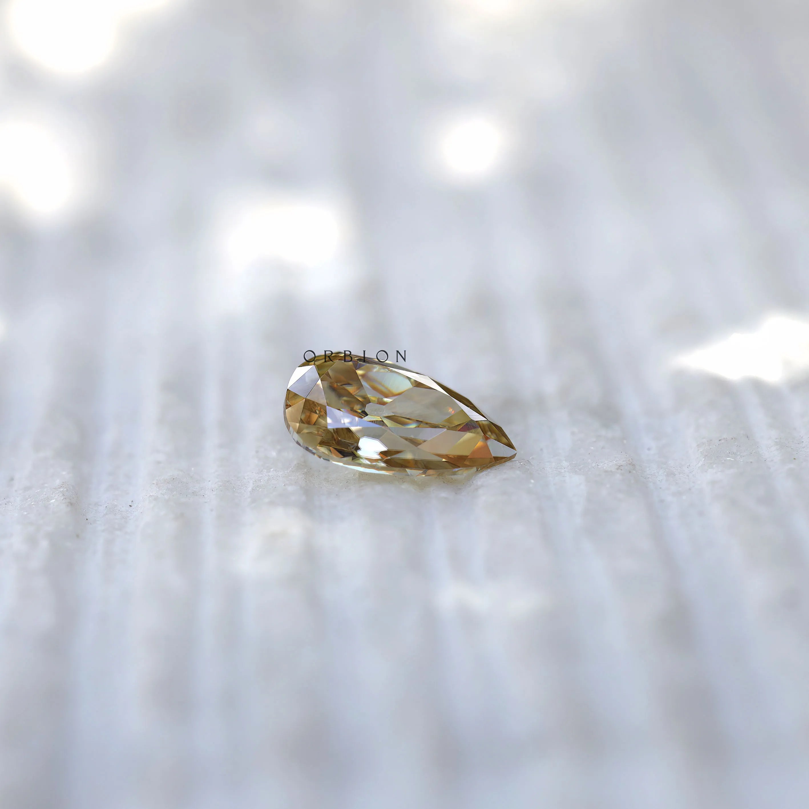 Elegant pear moissanite 2.80 ct soft champagne hue old mine cut