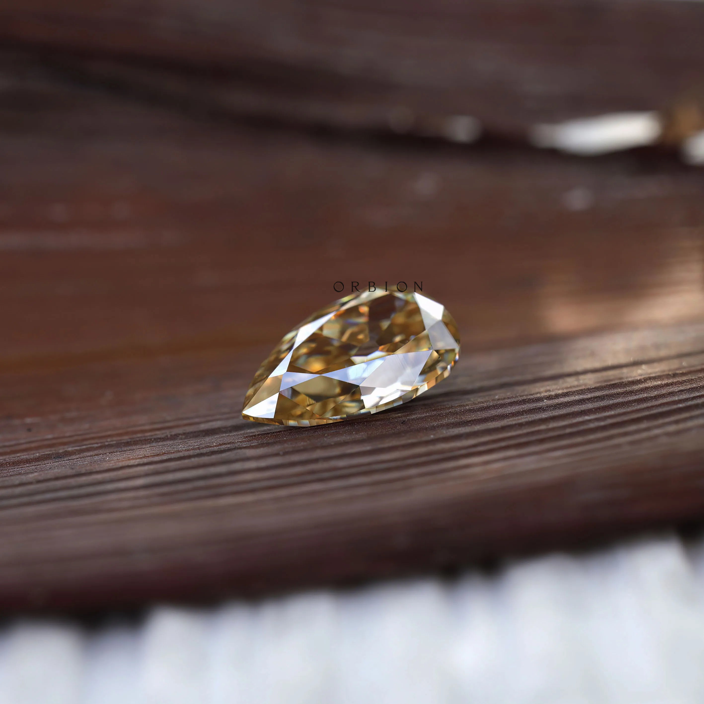 2.80 ct Antique cut pear moissanite in light golden champagne shade