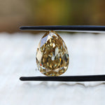 Pear old mine cut yellowish moissanite front view