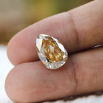 Yellow moissanite pear gemstone finger scale view