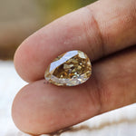 Old mine cut pear moissanite warm tone reflection