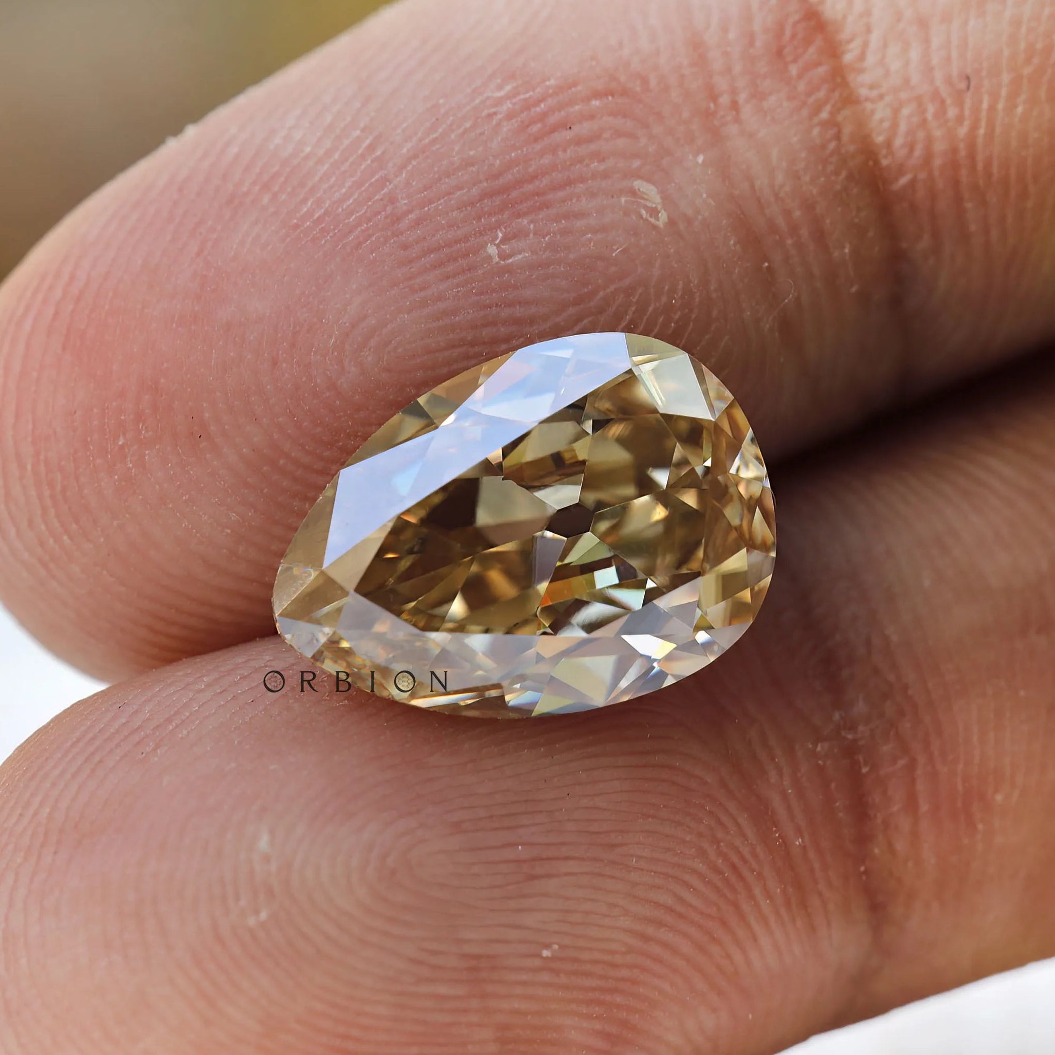Old mine cut pear moissanite warm tone reflection