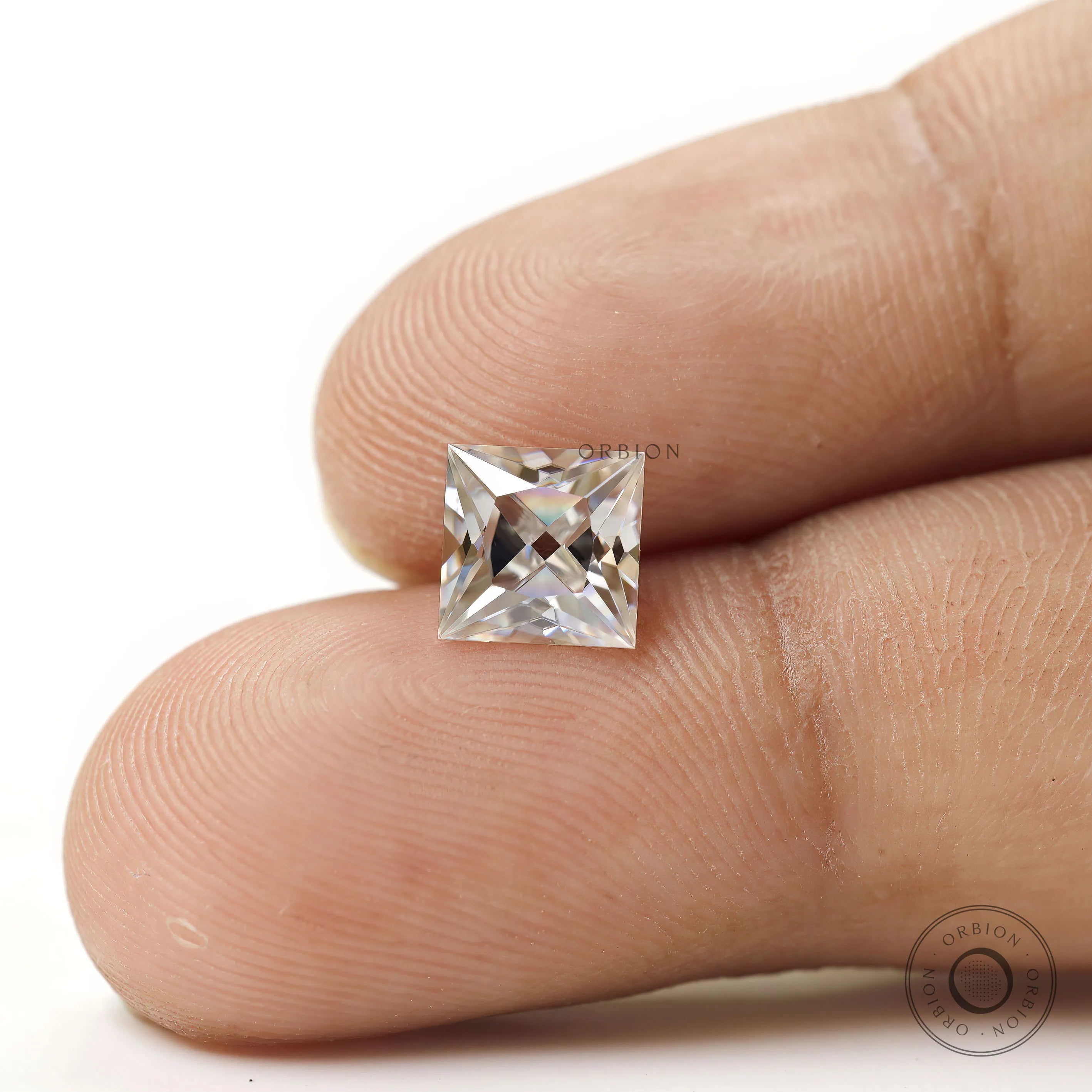 Close up finger hold princess moissanite stone square shape