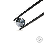 Close up of round dark grey moissanite with deep reflective brilliance