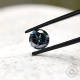 Dark grey moissanite round stone showing contrast of light and shadow