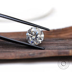 Loose round moissanite stone close-up brilliance view