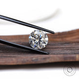 Loose round moissanite stone close-up brilliance view